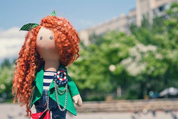istock handmade doll with curly red hair 539458178