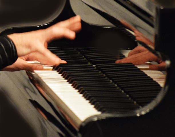 istock hand flying on the piano keys 539458426