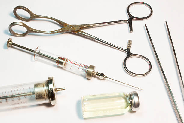 istock Old medical instruments on a white background 539458790