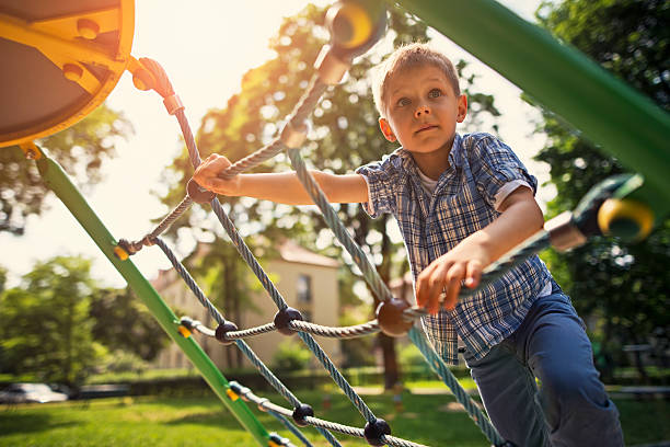 istock Little boy climbing at the playground 539459078