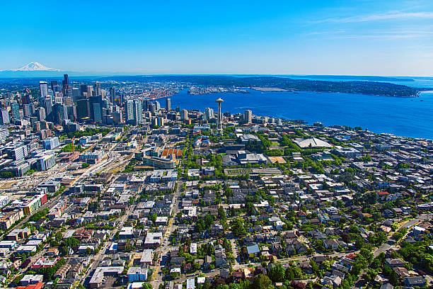 Aerial View of the Seattle Washington and Suburban Region A wide angle aerial view of the downtown skyline and surrounding suburban region of Seattle, Washington.  This image was shot from an elevation of approximately 500 feet during a helicopter photo flight.   puget sound stock pictures, royalty-free photos & images