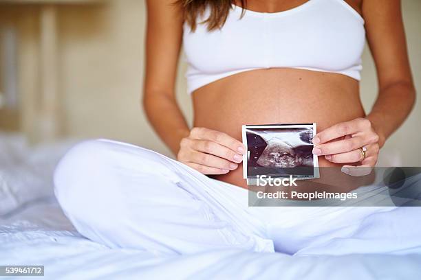 Shes Excited About Her Little One Stock Photo - Download Image Now - Pregnant, Ultrasound, Photographic Print