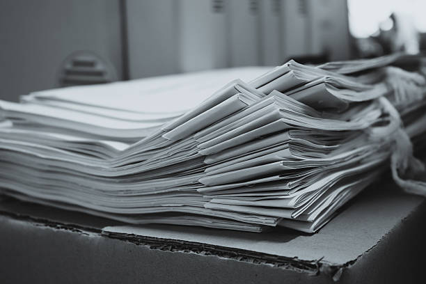 istock Pile of documents with colorful clips on desk stack up 539463524