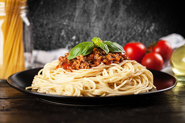 istock Spaghetti bolognese on dark background 539465116