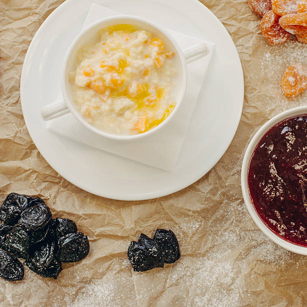 Millet porridge with pumpkin. Parchment background. Flat Lay