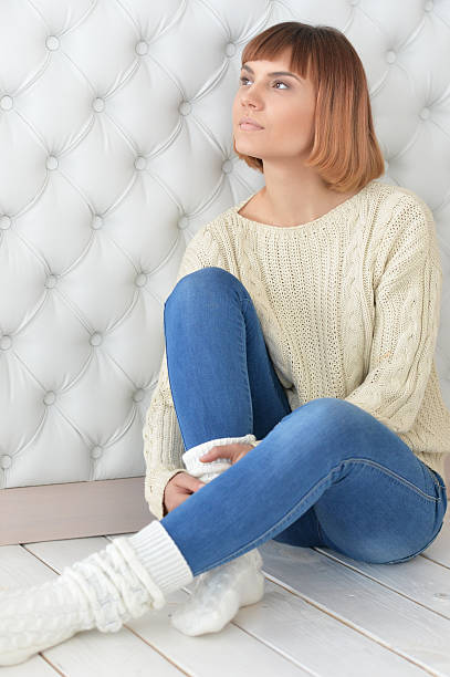 istock redhead girl sitting on floor 539469338
