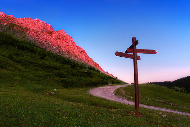 istock signpost in the mountain at sunset 539470032