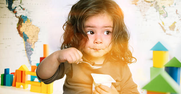 Girl eating yogurt