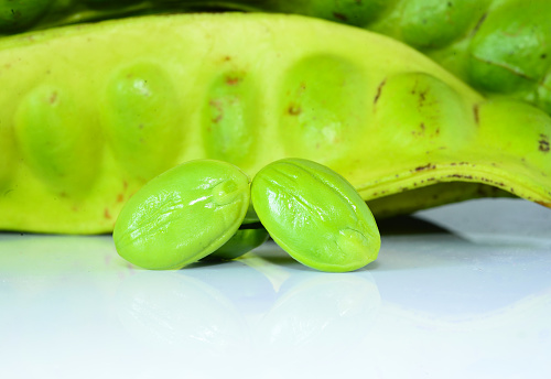 Tropical stinking edible beans on white background (Parkia Speciosa)