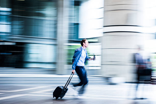 istock Blurred Business man running through building 539471732