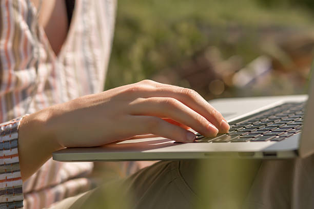 istock Female working on Laptop outdoors 539475952