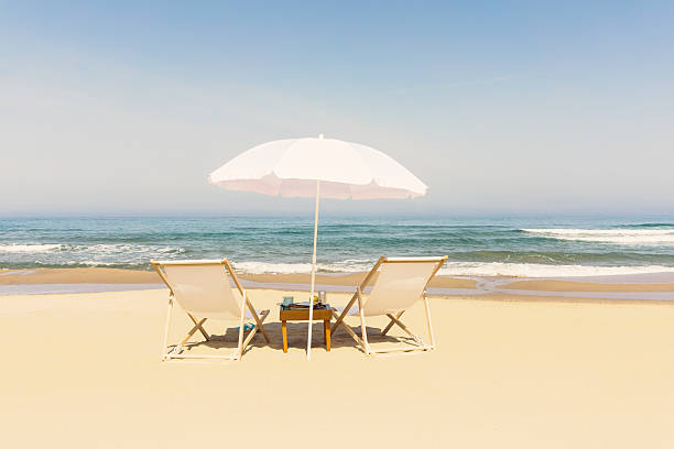 Summer at Ocean Beach with Two Loungers and Umbrella