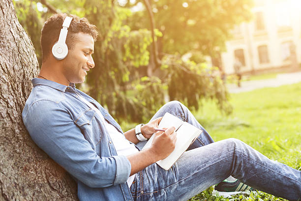 istock Talented young guy is writing in the nature 539480144