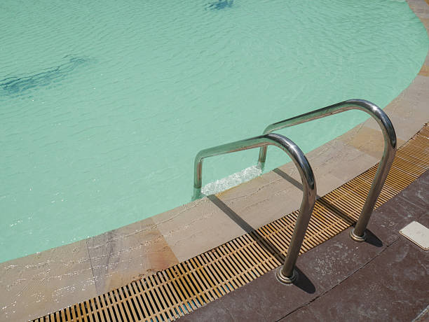 istock Swimming pool water with stair 539480448