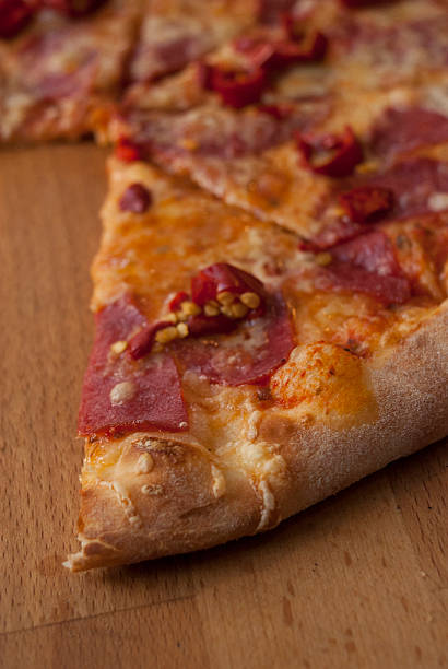 istock Delicious pizza served on wooden board 539481684