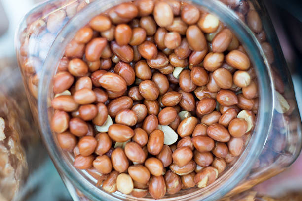 Common cooking peanuts in a jar .