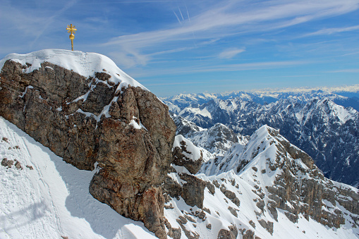 Skier on a slope facing the Alps mountain