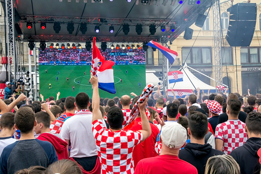 Zagreb, Croatia - June 12, 2016: Croatian football fans on the Ban Jelacic Square, watching EURO 2016 match Turkey vs. Croatia.