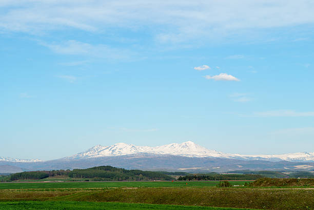 istock daisetuzan seen from Asahikawa Airport , Blue sky , with copy sp 539644430