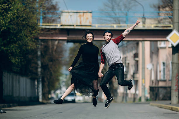 istock Beautiful young couple jumping 539644886