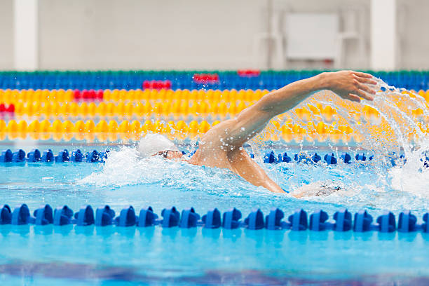 istock Man swimmer swimming crawl in blue water. 539647026