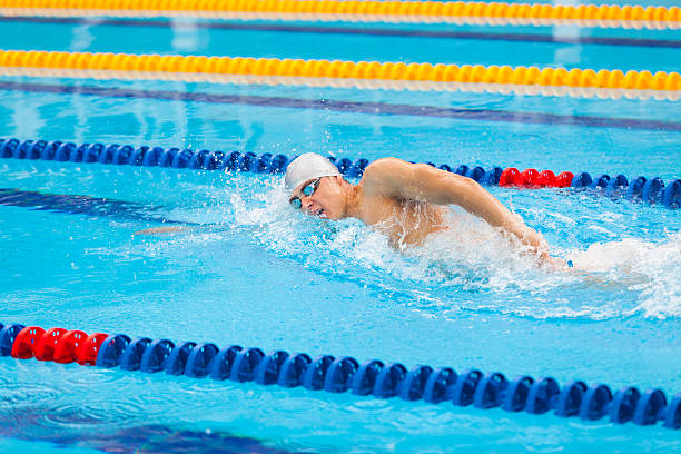 istock Man swimmer swimming crawl in blue water. 539647198