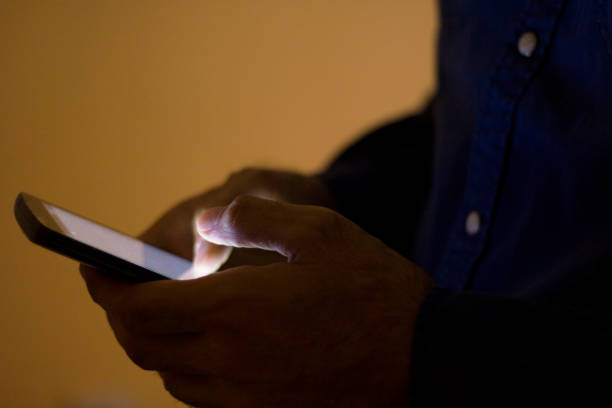 istock Close up of a man using mobile smart phone texting 539647620