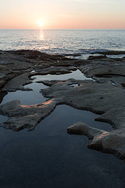 istock Rocky beach at sunrise. 539647884