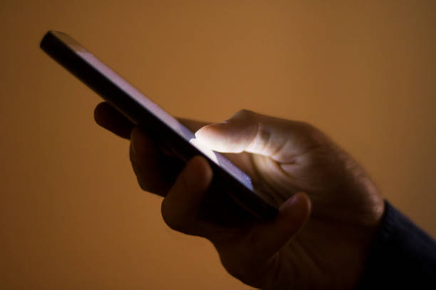istock Close up of a man using mobile smart phone texting 539648020