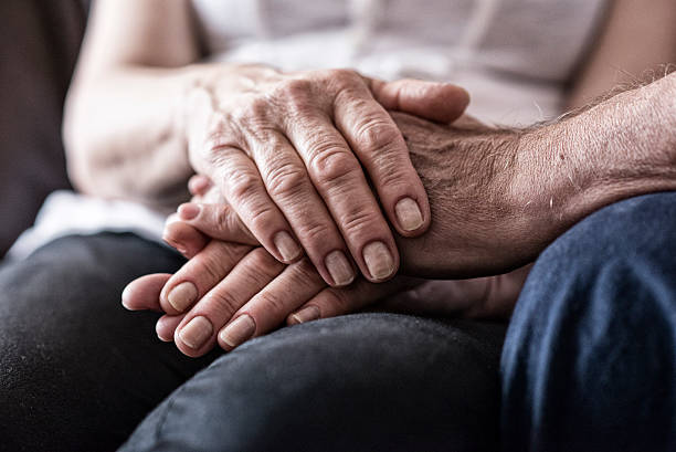 istock Women holding strong grandfather's hand 539648894