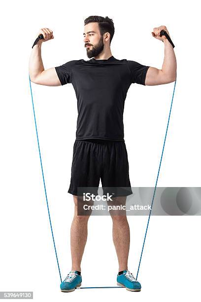 Athlete Doing Arms And Shoulders Exercise With Resistance Elastic Bands Stock Photo - Download Image Now