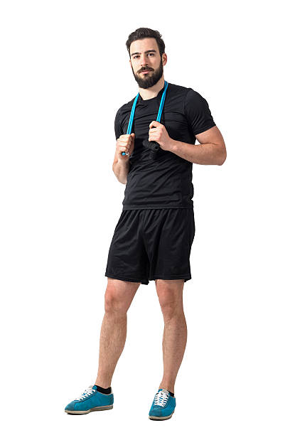 istock Young fit athlete carrying resistance bands looking at camera. 539649370
