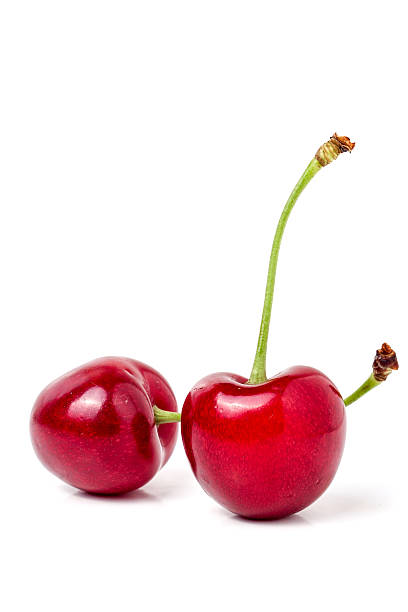 istock two sweet cherry closeup isolated on white background 539651320