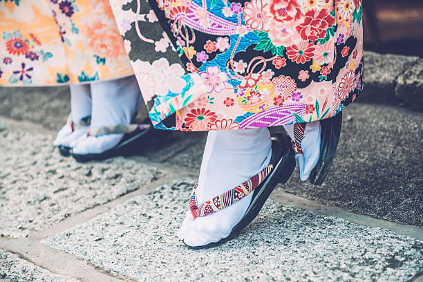 Japanese Women in Kimono Wearing Tabi and Getas, Kyoto, Japan Close-up of japanese women in kimono wearing stockings tabi and geta sandals in Gion, Kyoto, Japan. Feet and part of the kimono seen. Copy space. Nikon D800, full frame, XXXL. iStockaLypse Kyoto 2016. japan women human foot japanese culture stock pictures, royalty-free photos & images