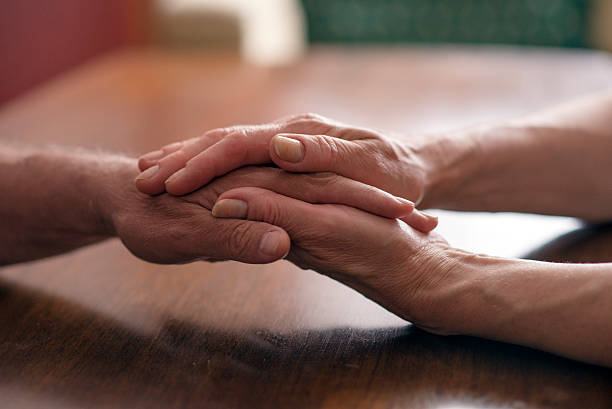 istock Elderly man and woman hands 539652670