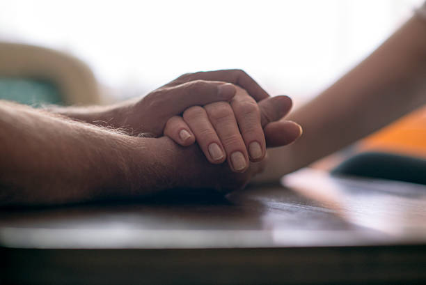 istock Elderly people holding hands. Closeup. 539652950