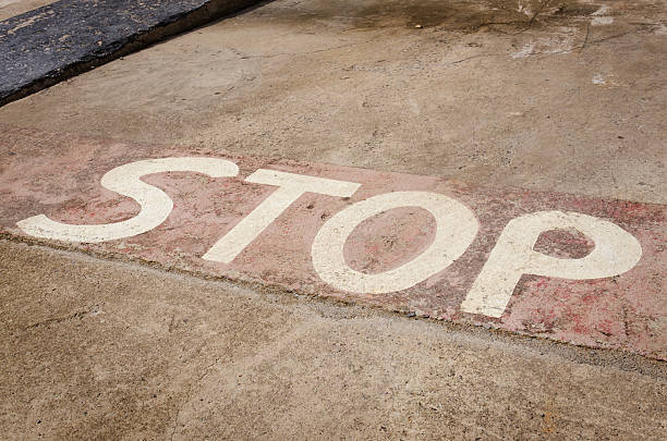 istock Stop sign on concrete road 539653120