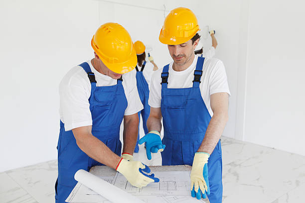 istock Team of buildres with plan 539654250