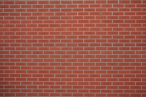 Red brick wall background with copy space.