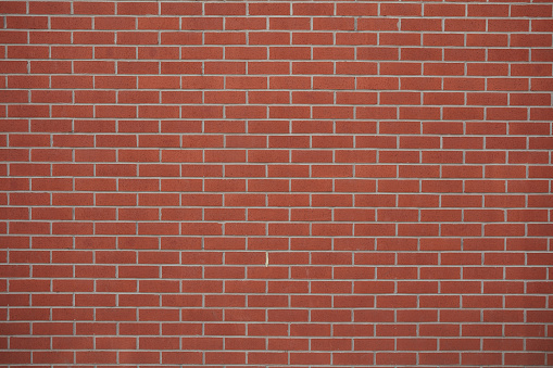 Red brick wall background with copy space.