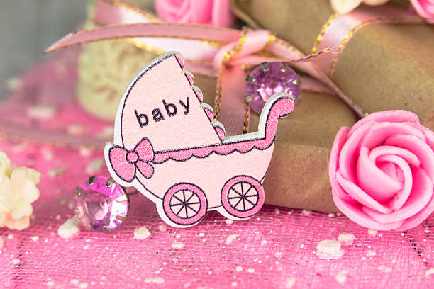 pink wooden carriage figure with wrapped presents - baby congratulating toy birthday imagens e fotografias de stock