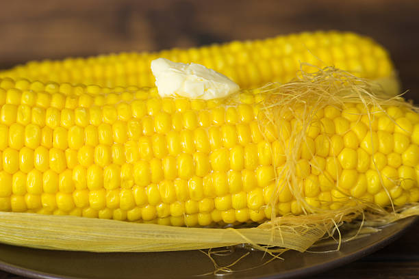 istock Close up of boiled corn with melting butter peace 539657894