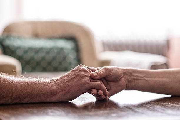 istock Senior couple hands, Close up image 539658426