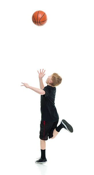 istock Little boy playing with basketball 539658816