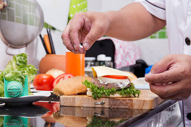 Chef cooking and decorated Hamburger