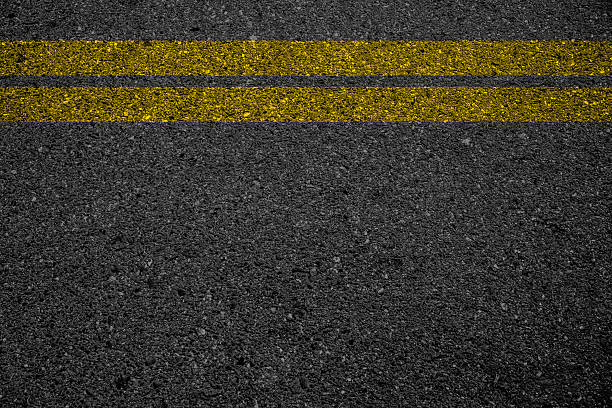 istock Double yellow line on asphalt road. 539661928