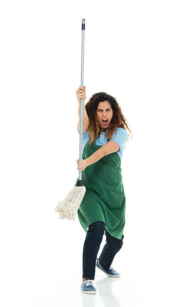 istock Angry janitor fighting with mop 539662360