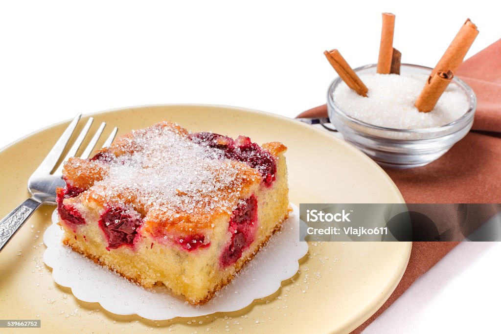 Sour cherry cake Sour cherry cake. Slices of sour cherry cake with sugar and cinnamon sticks. Baked Pastry Item Stock Photo