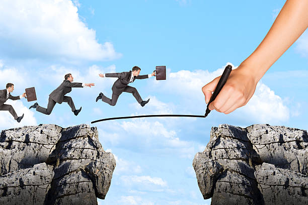 istock Hand drawing businessman running on rope and rock 539669966