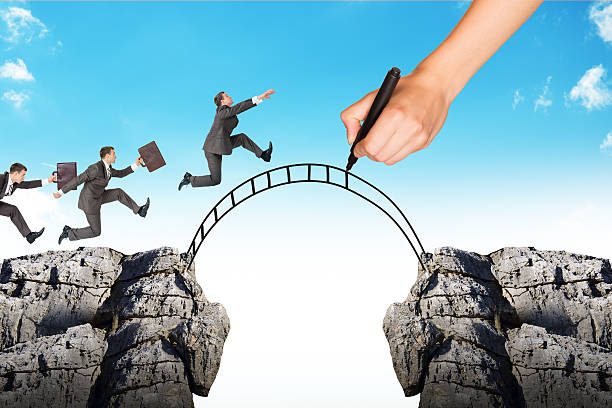 istock Hand drawing businessman running on bridge 539670026